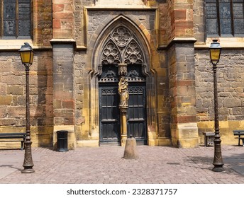 Side portal of the gothic St. Martin's Church. Saint Martin de Colmar collegiate church, gothic church, city of Colmar, Haut Rhin department, Alsace. Close-up with details