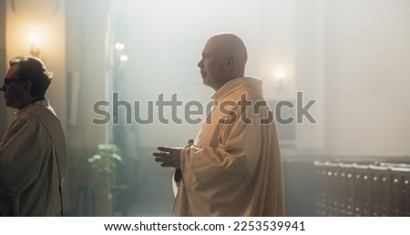 Side Portrait of a Christian Minister Walking in a Church Towards the Alter to Start Liturgy Ceremony. Priest Standing Gracefully, A Figure Of Faith and Reverence, a Reminder Of The Power Of Lord.