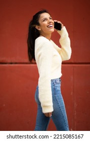 Side Portrait Happy Young Woman Walking With Mobile Phone