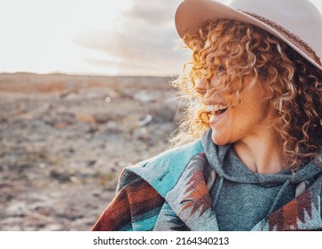 Side Portrait Of Overjoyed And Excited Cheerful Pretty Woman With Curly Blonde Hair And Hat Have Fun In Outdoor Travel Leisure Activity. Tourist Female People Smile And Laugh A Lot In Country Side