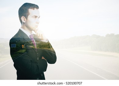 Side portrait of thoughtful young business man on road background. Decisions concept. Double exposure - Powered by Shutterstock