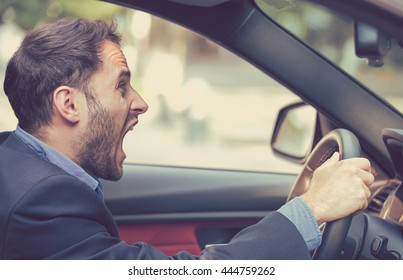 Side profile angry driver. Negative human emotions face expression 