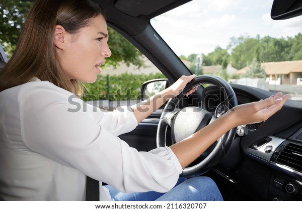 side profile angry female\
driver