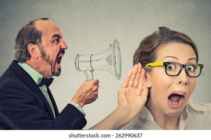 Side profile angry man screaming in megaphone curious nosy woman listening  isolated on wall background. Negative face expression emotion feeling. Propaganda breaking news social media power concept