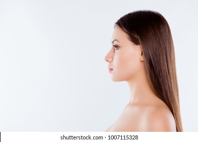 Side profile close up view portrait of pretty beautiful brown-haired brunette woman with pure flawless ideal sensual sensitive smooth skin straight nose and hair isolated on white background copyspace