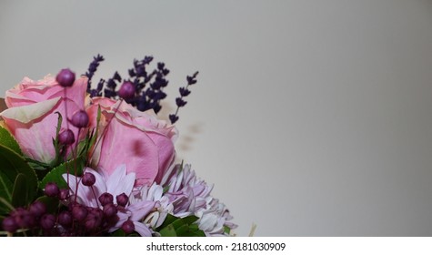 Side Profile Photo From Vibrant Flowers In Front Of A White Background, Behind Of A Bouquet Of Pink Roses, Pink Chrysanthemums, Purple Lavenders