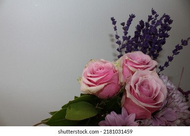 Side Profile Photo From Vibrant Flowers In Front Of A White Background, Behind Of A Bouquet Of Pink Roses, Pink Chrysanthemums, Purple Lavenders