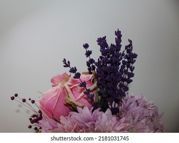 Side Profile Photo From Vibrant Flowers In Front Of A White Background, Behind Of A Bouquet Of Pink Roses, Pink Chrysanthemums, Purple Lavenders