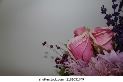 Side Profile Photo From Vibrant Flowers In Front Of A White Background, Behind Of A Bouquet Of Pink Roses, Pink Chrysanthemums, Purple Lavenders