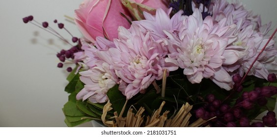 Side Profile Photo From Vibrant Flowers In Front Of A White Background, Behind Of A Bouquet Of Pink Roses, Pink Chrysanthemums, Purple Lavenders