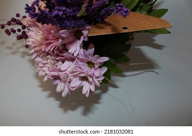 Side Profile Photo Vibrant Flowers In Front Of A White Background, A Bouquet Of Pink Roses, Pink Chrysanthemums, Purple Lavenders