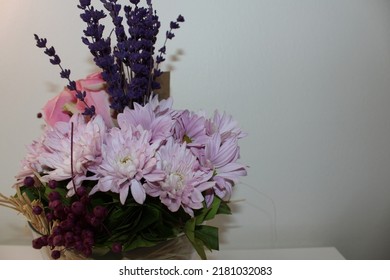 Side Profile Photo Vibrant Flowers In Front Of A White Background, A Bouquet Of Pink Roses, Pink Chrysanthemums, Purple Lavenders