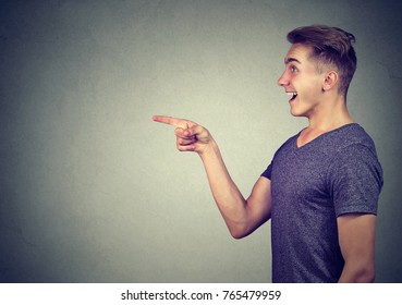 Side Profile Of A Surprised Man Pointing Finger 