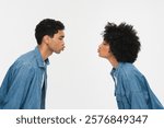 Side profile view young african american couple in love woman man in denim casual clothes affection while kissing each other closed eyes isolated on white color background studio portrait