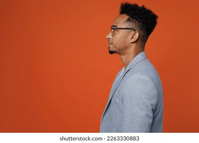 Side profile view young confident smart successful employee business man corporate lawyer wearing classic formal grey suit shirt glasses work in office isolated on plain red orange background studio - Shutterstock ID 2263330883