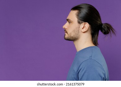 Side Profile View Young Serious Calm Latin Spanish Italian Man 20s Wear Basic Casual Blue T-shirt Isolated On Plain Purple Color Background Studio Portrait. People Lifestyle Human Appearance Concept