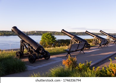 Side Rear View Of Row Of Old Cannons On The Sillery Belvedere, With The St. Lawrence River And The South Shore Seen In The Background During A Spring Morning, Quebec City, Quebec, Canada