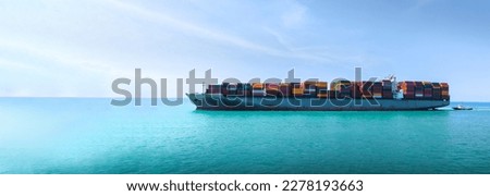 Side Ship view of Cargo Container Ship with Tug boat carrying container and running very fast for export cargo from container yard port to custom ,Contrail line in the ocean