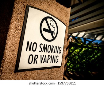 Side Shot Of A “no Smoking Or Vaping” Sign