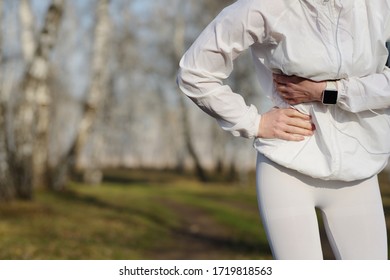 Side Stitch - Woman Runner Side Cramps After Running.