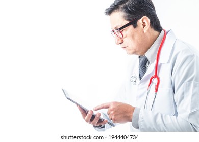 Side Tom Of Doctor With Gown, Stethoscope And Tie Reviewing Information Or Diagnosis On A Tablet On White Background. Medicine And Technology Concept