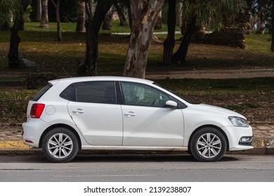Side; Turkey – March 01 2022:  white Volkswagen Polo is parked  on the street on a warm day 