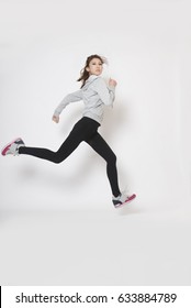 Side View Of Active Sporty Young Running Woman Runner.