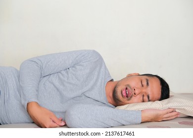 Side view of Adult Asian man sleep soundly 