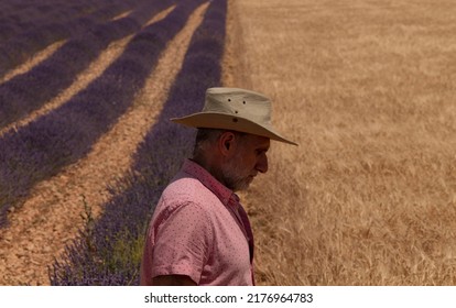 Side View Of Adult Man In Cowboy Hat In Fields