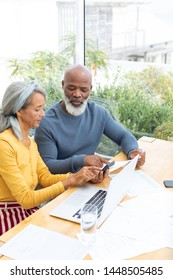 Side View Of African American Couple Calculating Finances. Authentic Senior Retired Life Concept