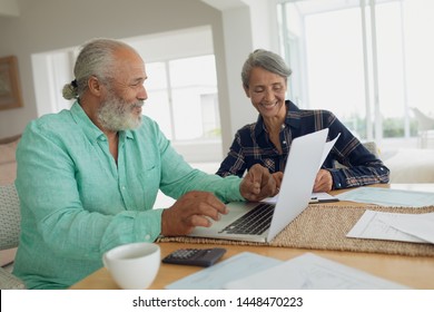 Side View Of African-American Couple Doing Finances On The Table Indoor. Authentic Senior Retired Life Concept