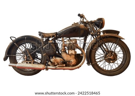 Side view of an ancient weathered motorcycle