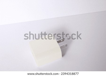 Side View of Apple 20W US Plug Wall Charger on White Background
