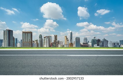 Side View Of Asphalt Road Highway With Modern City Skyline