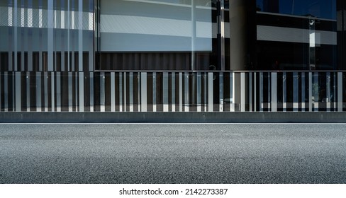 Side view asphalt road and modern building exterior background