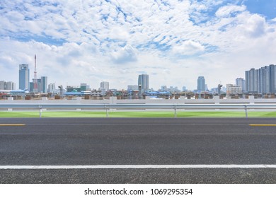 Side View Asphalt Road Near The Modern City.