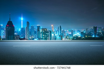 Side view asphalt road on night scene near the modern city . - Shutterstock ID 727441768