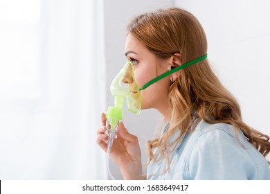 Side View Of Asthmatic Woman In Respiratory Mask