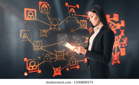 Side view of attractive young european businesswoman using tablet with glowing business interface on blurry office interior background. Social network and hud concept. Double exposure 