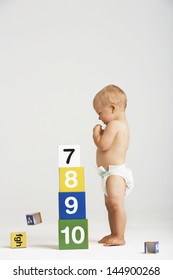 Side View Of Baby Building Blocks With Numbers Isolated On White Background