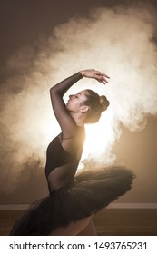Side view ballet posture in smoke