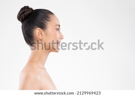 Side view of Beautiful Asian woman looking at camera smile with clean and fresh skin Happiness and cheerful with positive emotional,isolated on white background,Beauty and Cosmetics Concept