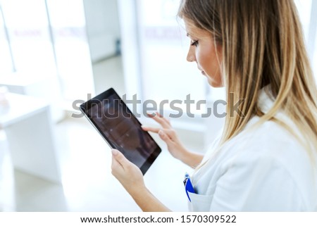 Similar – Female doctor showing an x-ray on the tablet