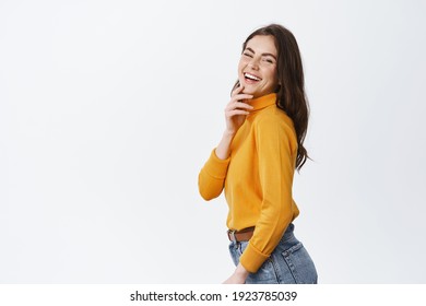 Side View Of Beautiful Candid Woman Laughing And Smiling, Showing White Perfect Teeth And Natural Face With Light Makeup, Standing Happy Against White Background.