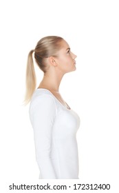 Side View Of A Beautiful Girl Looking Up On Isolated White