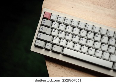 Side view of the beige color mechanical keyboard with dark background