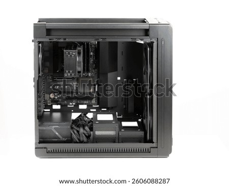 Side view  big tower, PC case, chassis,  inside motherboard, CPU, fan, SSD, memory, power supply unit with cables. 