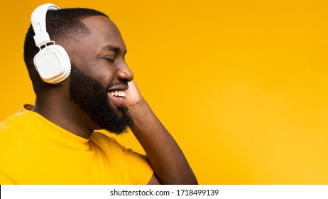 Side View Black Man With Headphones. Happiness, Yellow Day.