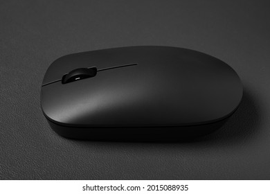 Side View Black Wireless Mouse On A Dark Background