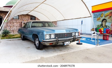 Side View Of A Blue Cadillac Eldorado Under The Canopy. Careful Storage Of A Vintage Car. Car Show Outdoor. Car Restoration